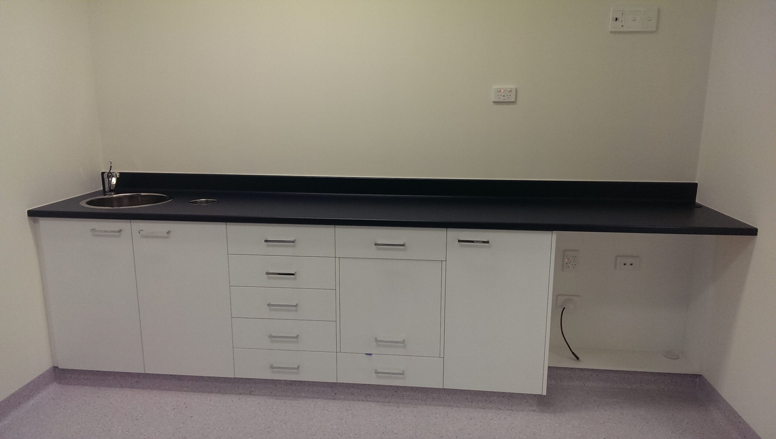 Custom white cabinetry with drawers